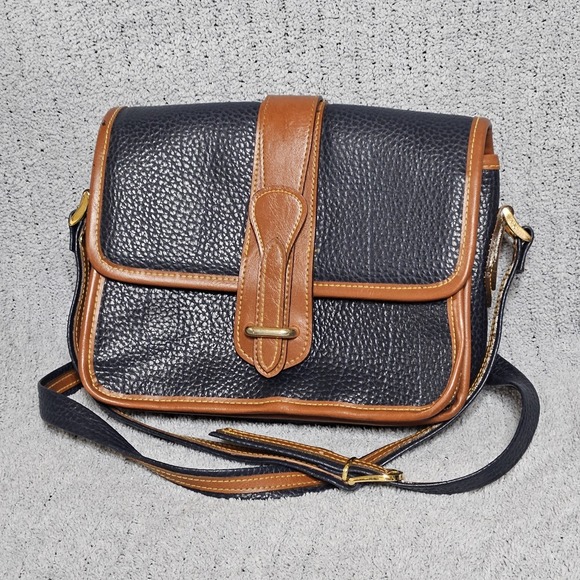 Dooney & Bourke Handbags - Dooney & Bourke Vintage All Weather Leather Crossbody Bag Navy‎ Blue Tan Trim